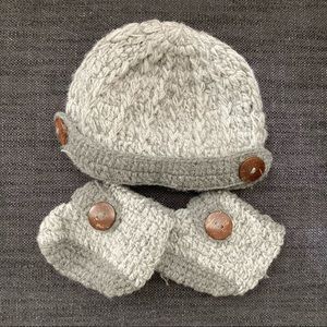Newborn hand-knit hat and booties